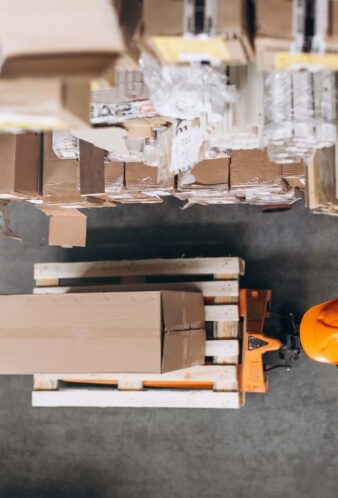 Young man working at a warehouse with boxes Young man working at a warehouse with boxes